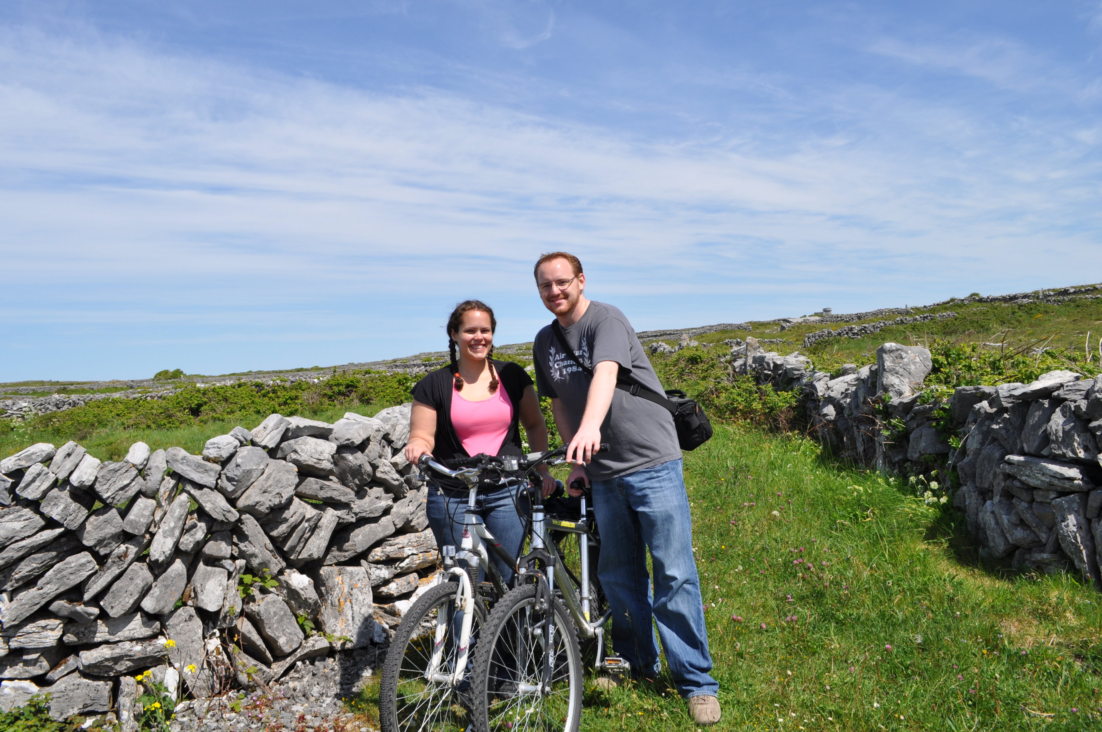 Couple with Bikes in Field on Aran Islands, Ireland