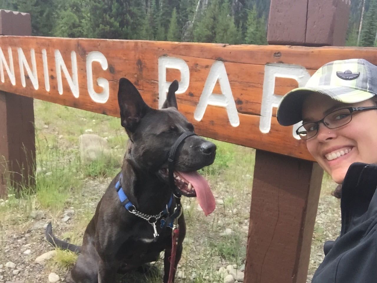 Dog and Woman Posing in front of Manning Park Sign