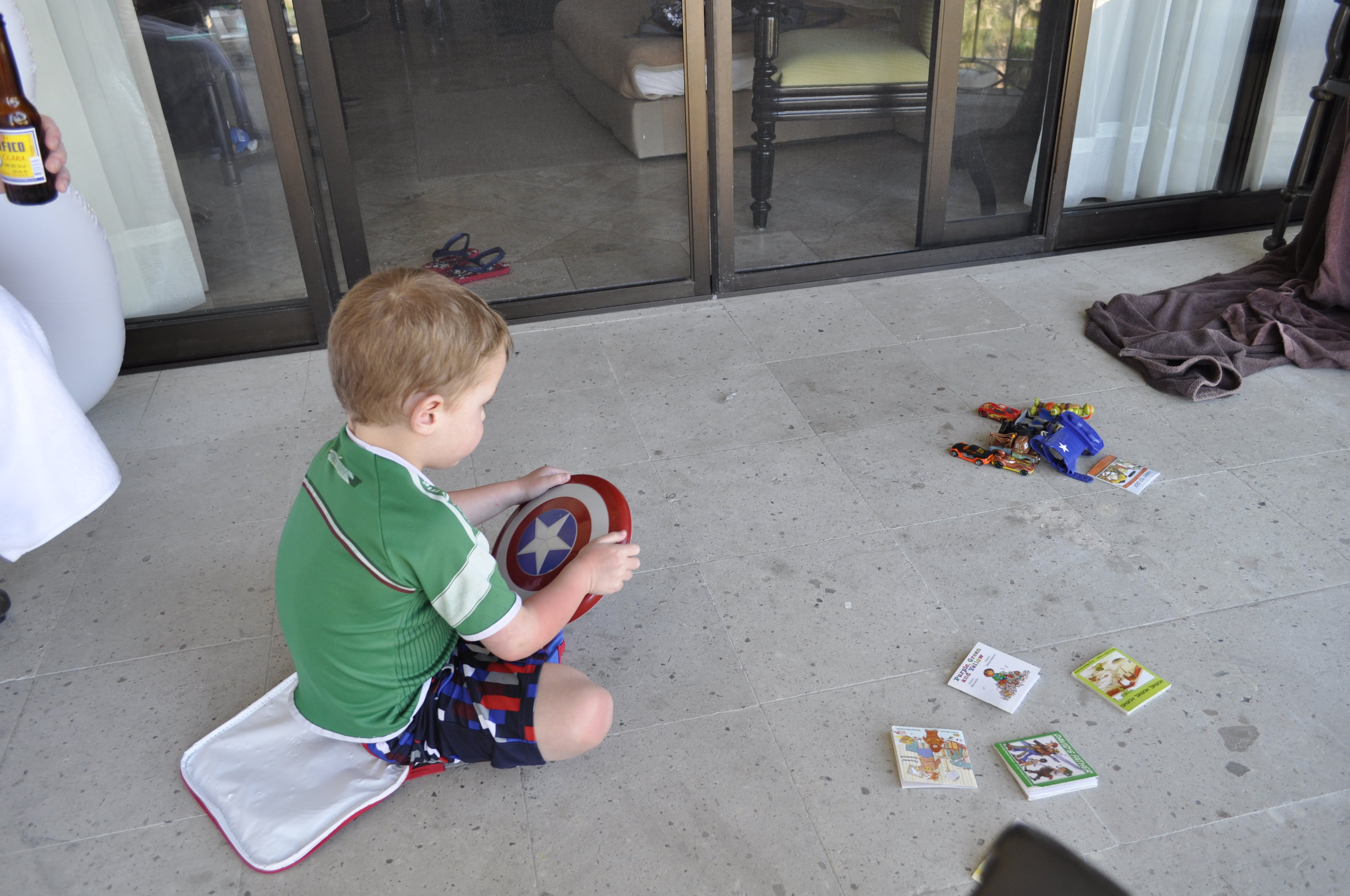 Kid Playing with Toys on Balcony
