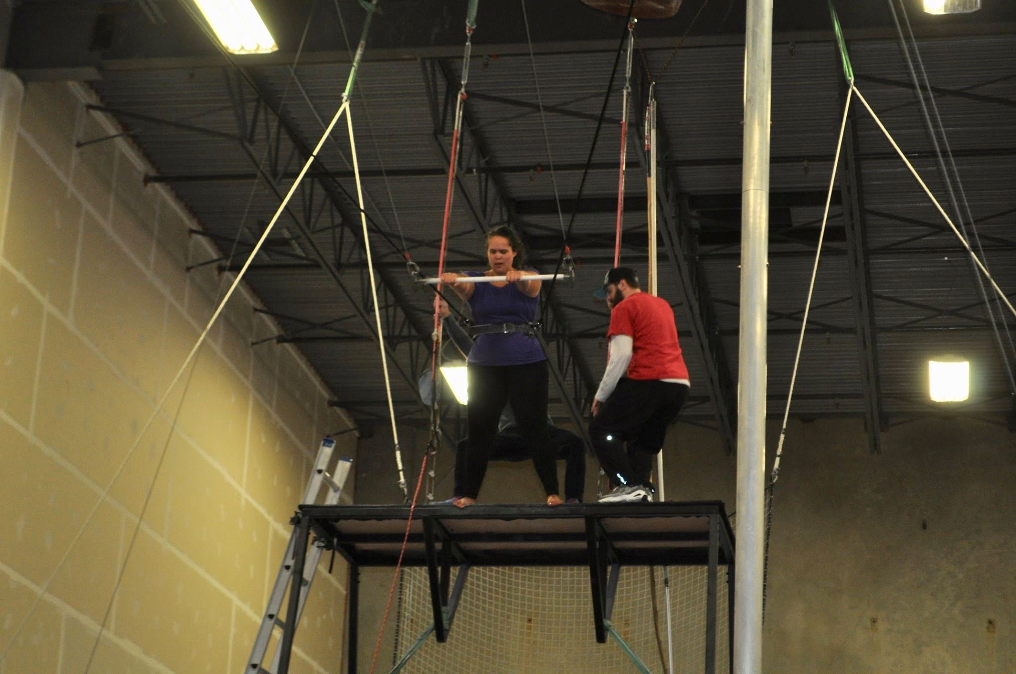 Amateur Woman Waiting to Jump off Trapeze Platform