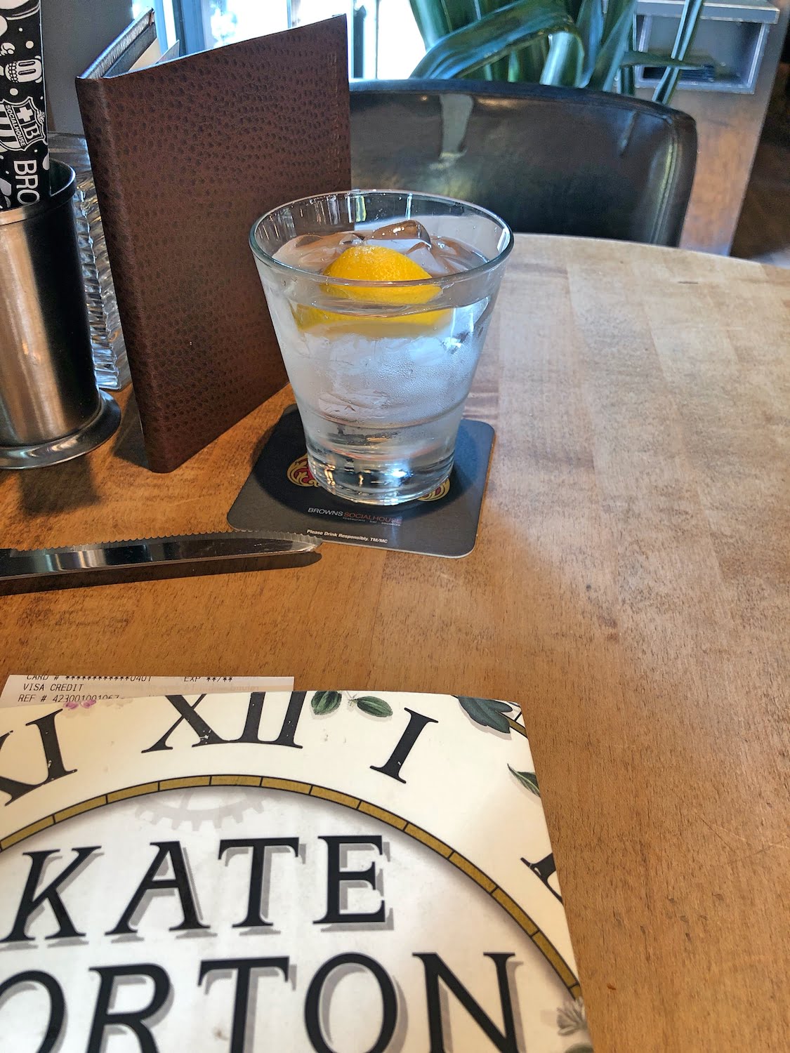 Book and Drink on Table at Restaurant